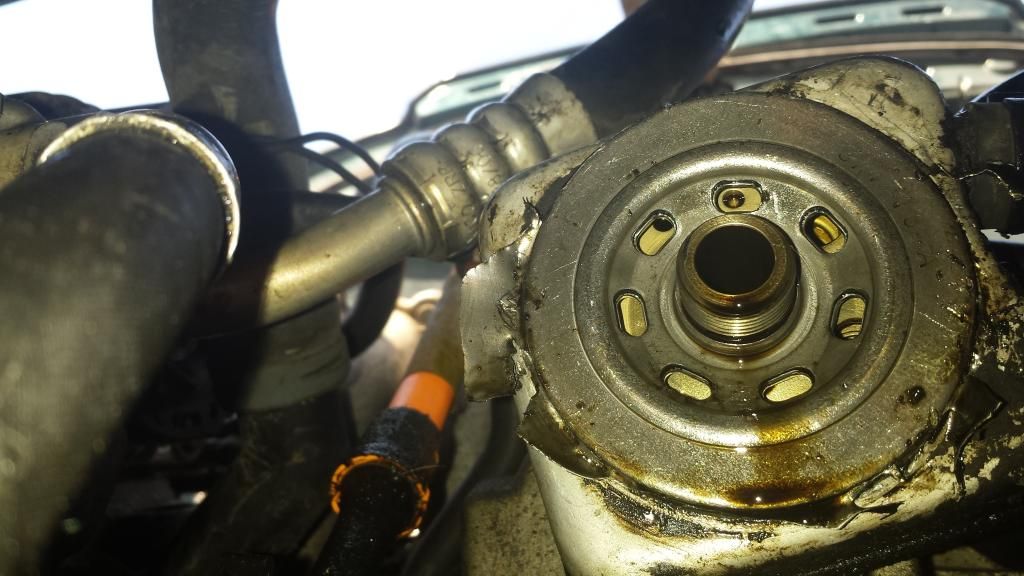 HELP! Oil filter torn apart and can't get lid off VW Vortex